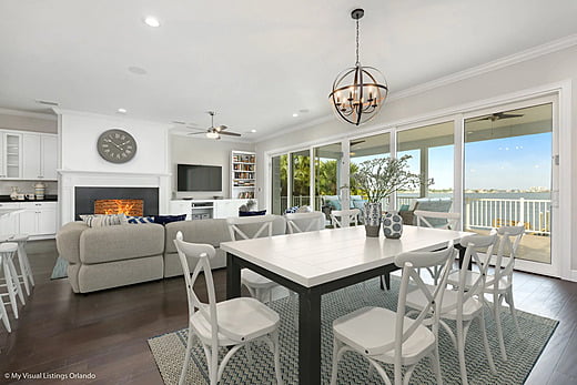 Dining room table in front of a fireplace