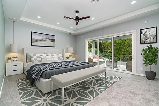 Bedroom with seating in a luxury home