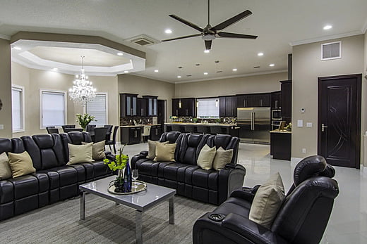 Transitional home entertainment room with sofa