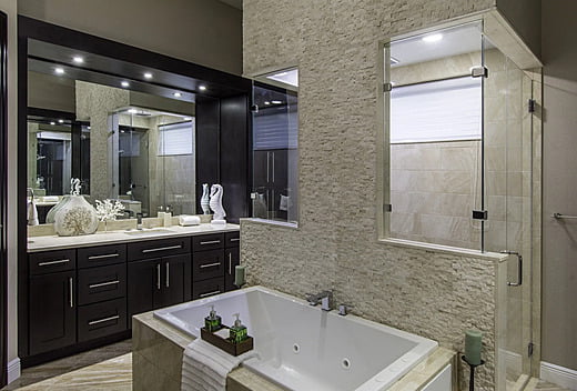 Bathtub and sink area in a new transitional home