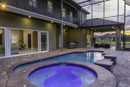 Spa and pool in a backyard